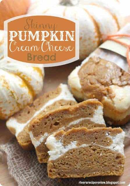 A delicious a moist pumpkin cream cheese bread with half of the calories! Skinny pumpkin cream cheese bread sliced into one inch slices with white pumpkins all around.