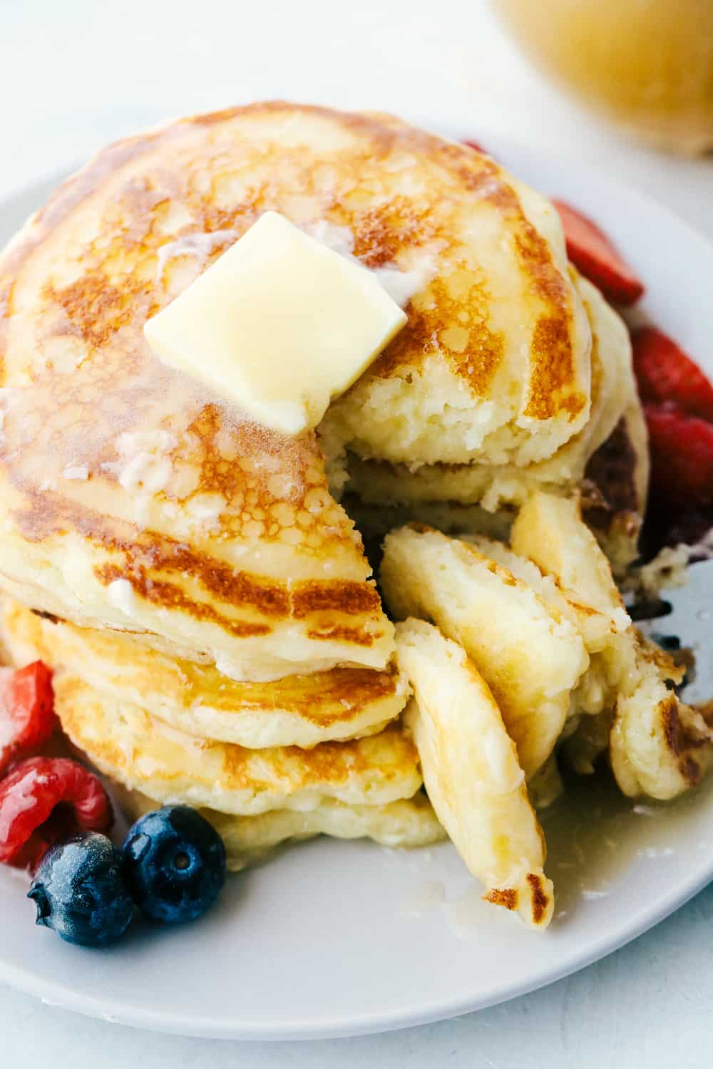 The best and only Buttermilk Pancake recipe that you will ever need! Perfectly fluffy every single time! Soft and pillowy with a tender crumb, these are going to be a hit at the breakfast table. Soft pillowy buttermilk pancakes ready to eat.