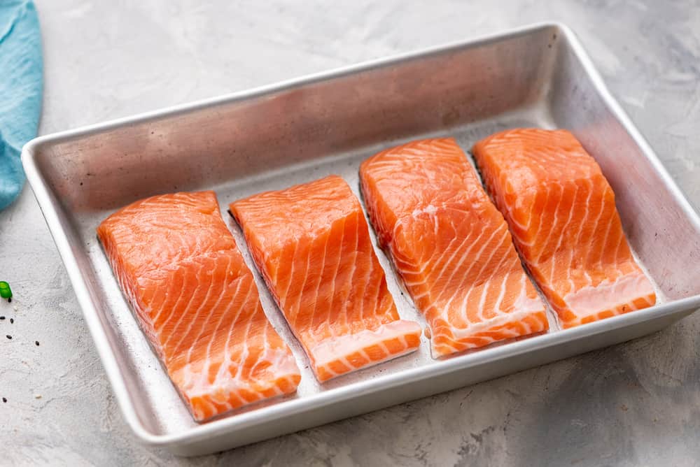 Baked Sesame Teriyaki Salmon is a five star salmon baked with the best homemade sesame teriyaki sauce. This is easily one of the best things that you will eat! salmon in a pan