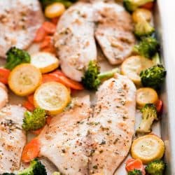 This Baked Tilapia and Roasted Veggies is a low calorie and high protein dish that comes together in less than 25 minutes!