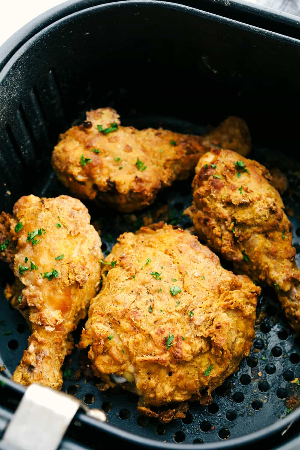 Crispy Air Fryer "Fried" Chicken is what Air Fryers were created to do! Crunchy golden seasoned outside, and tender, juicy, full of flavor inside! This is how chicken was meant to be eaten. Crispy ready to eat air fryer fried chicken.